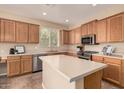 Spacious kitchen with stainless steel appliances, central island, and ample counter space at 4159 E Shannon St, Gilbert, AZ 85295