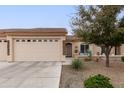 Charming single-story home with desert landscaping, a covered entrance, a 2-car garage, and neutral paint at 10960 E Monte Ave # 286, Mesa, AZ 85209