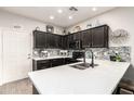 Charming updated kitchen with stainless steel appliances, modern countertops, and sleek dark cabinets at 10960 E Monte Ave # 286, Mesa, AZ 85209