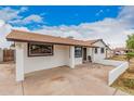 Single-story home featuring a brown roof, textured white exterior, and attached carport at 11403 N 57Th Dr, Glendale, AZ 85304