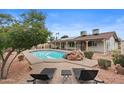 Relaxing backyard with a private pool, patio, and lush greenery at 11431 N 37Th Pl, Phoenix, AZ 85028