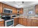 Stylish kitchen with stainless steel appliances and granite countertops at 11431 N 37Th Pl, Phoenix, AZ 85028