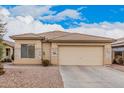 Charming single-story home with desert landscaping, stone accents and a two-car garage at 12530 W Jackson St, Avondale, AZ 85323