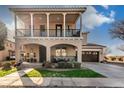 Inviting two-story home with a charming front porch and second story balcony at 13432 N 154Th Ln, Surprise, AZ 85379