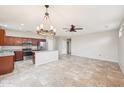 Open-concept living room and kitchen featuring stainless steel appliances and granite countertops at 15525 W Clear Canyon Dr, Surprise, AZ 85374