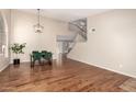 Spacious living area featuring hardwood floors and staircase leading to the second floor at 18421 N 12Th Way, Phoenix, AZ 85022