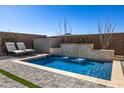 Sparkling pool with a water feature and lounge chairs for relaxation at 21413 N 59Th St, Phoenix, AZ 85054