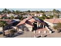 Beautiful view of a single-story home with solar panels and a well-kept roof at 26637 S New Town Dr, Sun Lakes, AZ 85248