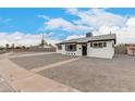 Charming renovated single-story home with crisp white paint, black trim, and xeriscaped yard at 3009 W Alice Ave, Phoenix, AZ 85051