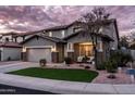 Inviting two-story home with a cozy front porch and a well-maintained front yard at 3274 E Isaiah Ct, Gilbert, AZ 85298