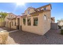 Side view of a charming stucco home with a red tile roof and low maintenance desert landscaping at 5474 W Fulton St, Phoenix, AZ 85043