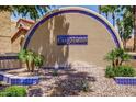 Attractive entryway with blue tiled accents and beautiful landscaping that welcomes you to this community at 5640 E Bell Rd # 1081, Scottsdale, AZ 85254