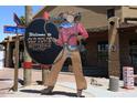 Welcome to Old Town Scottsdale, Arizona sign with cowboy cartoon character in front of a commercial building at 8335 E Montecito Ave, Scottsdale, AZ 85251