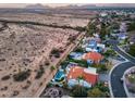 A beautiful aerial view of luxury homes with private pools bordering a scenic desert landscape at 9921 E Doubletree Ranch Rd, Scottsdale, AZ 85258