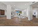 Bright and spacious living room with wood floors, modern furniture, and an abundance of natural light at 11232 E Palomino Rd, Scottsdale, AZ 85259