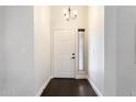 Bright entryway featuring sleek hard surface floors and neutral paint that creates an inviting atmosphere at 15764 W Shiloh Ave, Goodyear, AZ 85338