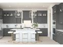 Modern kitchen with gray cabinets, white countertops, stainless steel appliances, and stylish pendant lighting at 20334 W Roma Ave, Buckeye, AZ 85396