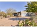 Home with large garage, desert landscaping, and a desert view at 2409 N 57Th St, Scottsdale, AZ 85257