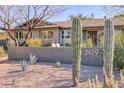 Well-maintained desert landscaping surrounds the home at 2409 N 57Th St, Scottsdale, AZ 85257