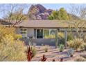 Single story home featuring desert landscaping and mountain views at 2409 N 57Th St, Scottsdale, AZ 85257