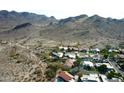 Expansive aerial view of a residential neighborhood nestled in a mountainous desert landscape at 3501 E Dunlap Ave, Phoenix, AZ 85028