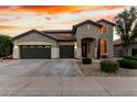 Beautiful two-story home featuring a spacious driveway, three-car garage, and meticulously maintained landscaping at 4429 W Paseo Way, Laveen, AZ 85339