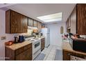 Functional kitchen with white appliances and ample cabinet space at 9602 W Ironwood Dr # A, Peoria, AZ 85345