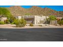 Desert home with beautiful landscaping and mountain views at 11919 N 138Th St, Scottsdale, AZ 85259