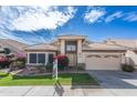 Charming single-Gathering home featuring a well-maintained lawn, two-car garage and desert landscaping at 15644 S 13Th Pl, Phoenix, AZ 85048