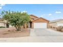 Exterior view of home showing neutral paint, landscaping, and a two-car garage at 1619 E Silverbirch Ave, Buckeye, AZ 85326