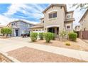 Two-story home featuring a neutral color scheme and tidy landscaping at 19075 E Pelican Dr, Queen Creek, AZ 85142