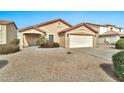 A well-maintained single-Gathering home with a desert landscape and a two-car garage at 2210 E Caspian Way, San Tan Valley, AZ 85140