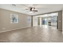 Spacious living room with tile flooring and an open layout to the kitchen at 2210 E Caspian Way, San Tan Valley, AZ 85140