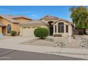 Inviting home with well-maintained landscaping, tile roof, and attached garage at 2416 E Cielo Grande Ave, Phoenix, AZ 85024