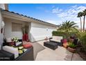 Inviting outdoor patio with comfortable seating, lush greenery, and sunny ambiance at 2568 N Armour Ave, Mesa, AZ 85215