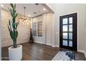 Elegant entryway featuring a decorative front door and a faux-stone accent wall at 34801 N 53Rd St # 2, Cave Creek, AZ 85331