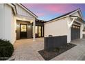 Elegant entrance with a paved courtyard, dark accents, and a modern design at 3538 E Glenrosa Ave, Phoenix, AZ 85018