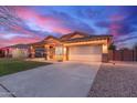 Attractive single-story home with a two-car garage and well-maintained landscaping at 3768 S Coach House Dr, Gilbert, AZ 85297