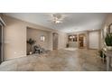 A bright and open living room with tile floors and neutral paint at 3872 E Flower St, Gilbert, AZ 85298