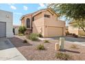 Two story home with a two car garage and desert landscaping, as seen from the side at 6717 E Saddleback Cir, Mesa, AZ 85215