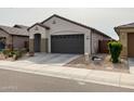 Attractive single story home with a two car garage, low maintenance front yard, and concrete driveway at 8907 W Bethany Heights Dr, Glendale, AZ 85305