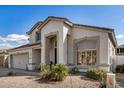 Elegant two-story home featuring desert landscaping, a tile roof, and an arched front entrance at 901 N Woodburne Dr, Chandler, AZ 85224