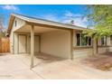 Charming single-story home with a covered carport and neutral exterior paint at 904 W Tulane Dr, Tempe, AZ 85283