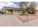 Inviting single-story home with covered parking and a low-maintenance desert landscape at 904 W Tulane Dr, Tempe, AZ 85283