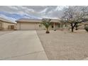 Charming single story home with low maintenance landscaping, long driveway, and tile roof at 14545 S Cherry Hills Dr, Arizona City, AZ 85123