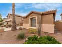 Inviting exterior view of a single Gathering home with desert landscaping at 16830 S Coleman St, Phoenix, AZ 85045