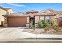 Charming single-story home featuring a tile roof, desert landscaping, and an attached two-car garage at 1743 W Flintlock Dr, San Tan Valley, AZ 85144