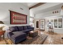 Cozy living room featuring tile floors, high ceilings with wooden beams, and lots of natural light at 1975 E Sunburst Ln, Tempe, AZ 85284