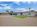 Single-story home showcasing desert landscaping and proximity to neighboring properties at 2205 W Cambridge Ave, Phoenix, AZ 85009