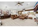 Inviting open-plan living room with a dining area, natural light, and a neutral color palette at 22222 N 54Th Way, Phoenix, AZ 85054